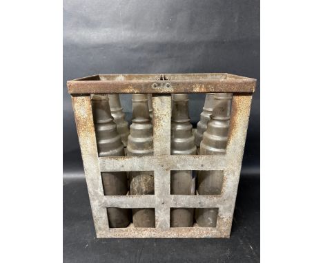 A crate of eight Esso Extra Motor Oil bottles. 