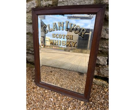A Clan Ivor Scotch Whisky bevel edged advertising mirror in wooden frame, 15 1/2 x 20 3/4".  