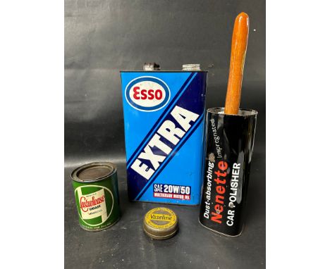 An Esso Extra SAE 20W/50 five litre oil can, a Wakefield Castrolease Grease Graphited 1lb can, a tin of Chesebrough Vaseline 