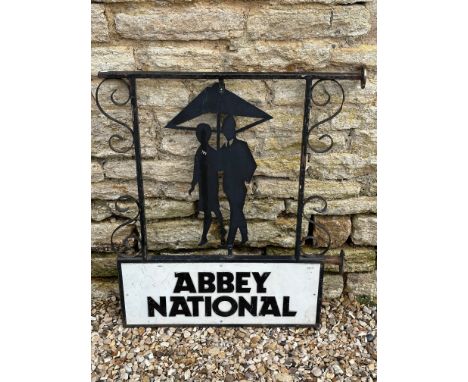 An unusual Abbey National Building Society double sided metal advertising sign depicting their original Eric Winter logo of a