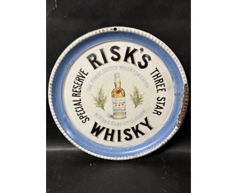 A Risk's Whisky enamel advertising tray by Hancock &amp; Corfield Ltd. 12" diameter.