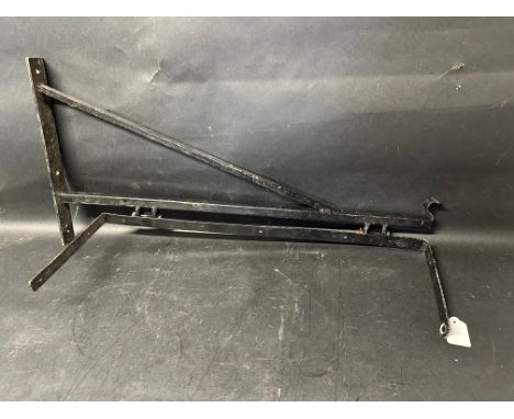 A wall hanging bracket for enamel signs etc. 30" wide overall, 25 1/2" approx width of hanging attachment. 