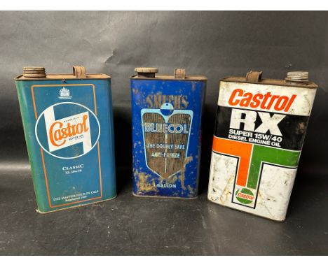 A Wakefield Castrol Motor Oil can, a Smiths Bluecol Anti-freeze gallon can and a Castrol RX Super 15W/40 Diesel Engine Oil ca