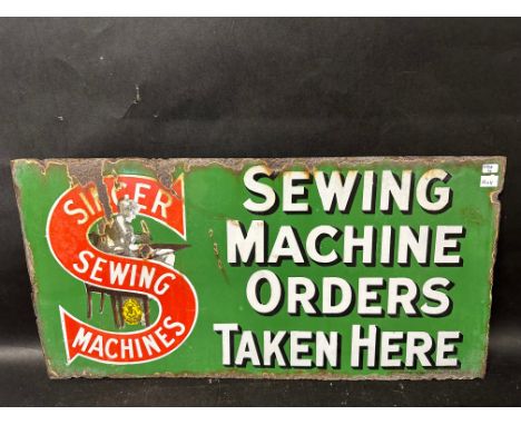 A Singer Sewing Machines double sided enamel advertising sign, 22 x 11". 