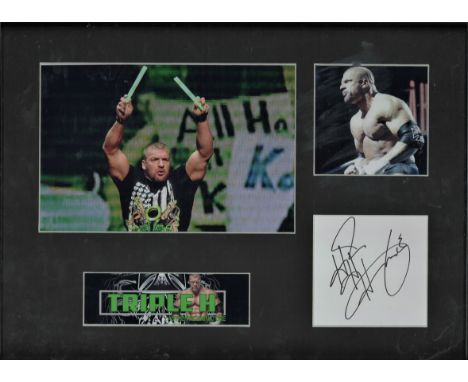 Wrestling Triple H 17x13 approx framed and mounted signature piece includes two colour photos and a signed album page mounted