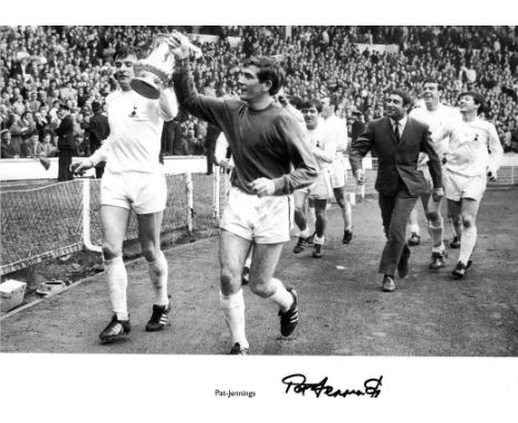 Football Pat Jennings 12x16 approx signed b/w photo pictured celebrating with the FA Cup while playing for Spurs. Rolled. Goo