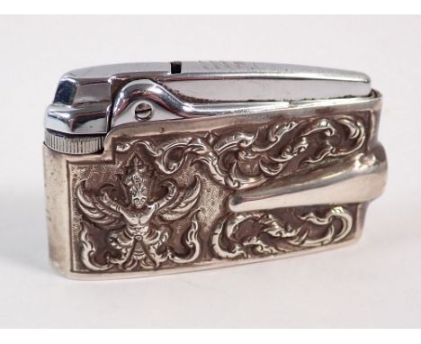 A sterling silver cased Ronson lighter with Eastern dancer decoration, 6.5cm long