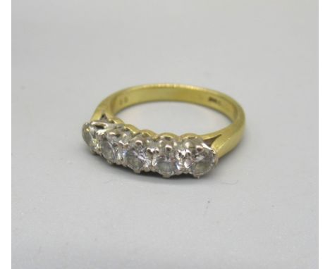 Yellow gold five stone diamond ring, the five round cut diamonds in claw setting on plain band, marks worn, approx. carat wei