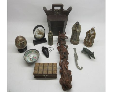 C20th Chinese carved hardwood figure of a dragon holding a flaming pearl, H49cm; Chinese carved green hardstone seal with sea