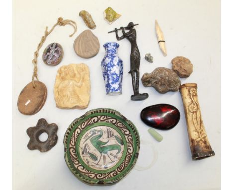 A large assortment of objects from various locations and time periods. To include a carved female figure, a hand-painted stud