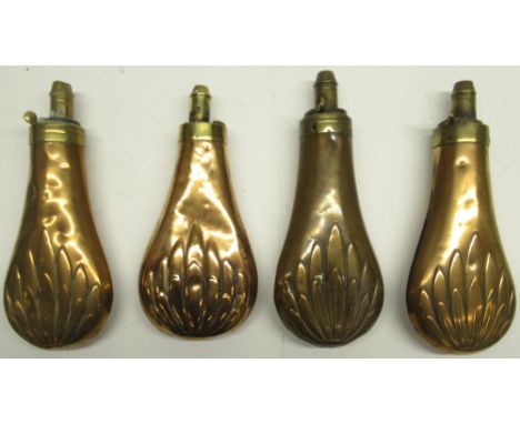 Four 19th century copper and brass embossed powder flask, decorated with leaf motifs, 19cm 