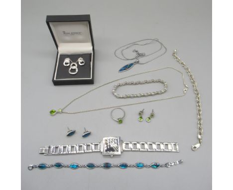 Silver drop pendant necklace set with green stones, matching earrings and ring, and a similar bracelet, all stamped 925, othe