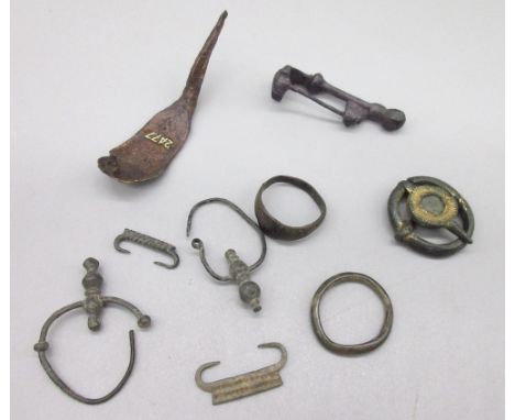Continental brooch (C40-20BC), a Austrian Roman cloak brooch (approx. C1st-C2nd AD), and other similar items. (Victor Brox co