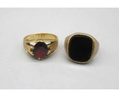 9ct yellow gold signet ring, the square face set with polished black stone, stamped 375, size N, and another 9ct gold ring se