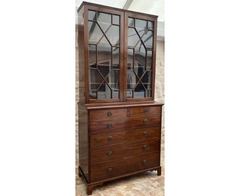 19th century mahogany secretaire bookcase, with moulded cornice and two astragal glazed doors above a fall front with fitted 