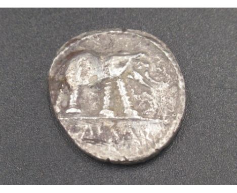 Julius Cæsar Denarius, obv. elephant walking right, trampling on dragon, rev. simpulum, sprinkler, axe and apex (3.1g)(Victor