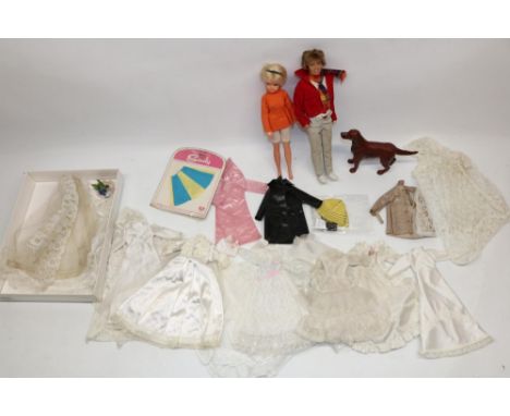 Early 1980s Sindy doll in orange top, later Paul doll, Sindy and Patch clothes and hat, and a large collection of doll weddin