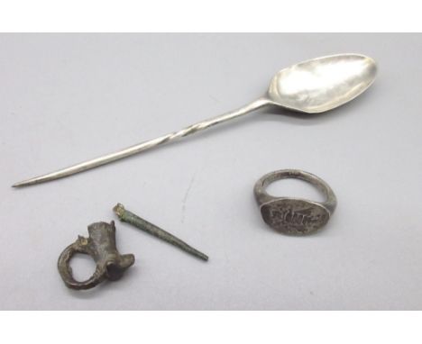 Hellenistic Greek silver insect ring, a Byzantine silver spoon, fragments of a pin brooch. (Victor Brox collection) 