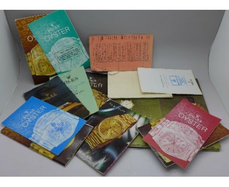 A collection of Rolex booklets and one Patek Philippe booklet
