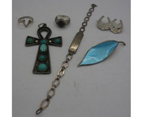 A Norwegian silver and enamel brooch, marked DA, a silver horseshoe brooch, Chester 1908, a scarab set cross pendant, a silve