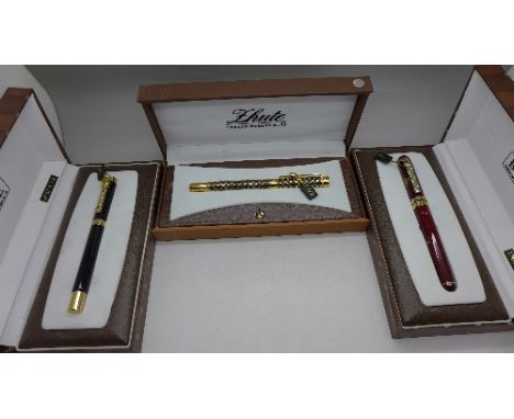 Three pens with gold plated nibs, boxed