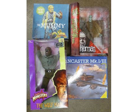 Two plastic assembly kits, a Revell Lancaster Mk 1/III and The Mummy, two plastic action figures, the Wolf Man and Herman