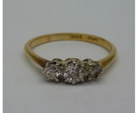 An 18ct gold, three stone diamond ring, weight 2.1g, size P