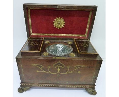 A Regency rosewood tea caddy with brass inlay and gilt metal feet, width 33cm