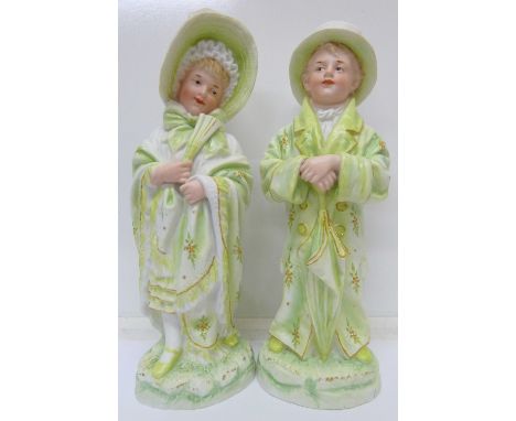 A pair of Victorian bisque figures of a boy and a girl, height 31.5cm