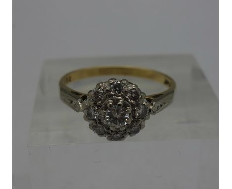 An 18ct gold and platinum set, diamond cluster ring, weight 3.7g, size O