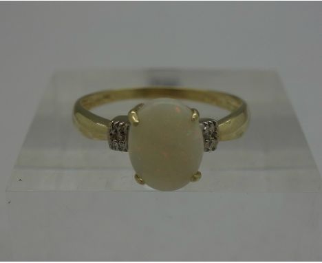 A 9ct gold, opal and diamond ring, weight 1.1g, size O