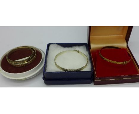 Three silver Christening bangles and a 9ct gold Christening bangle, weight of gold bangle 3g