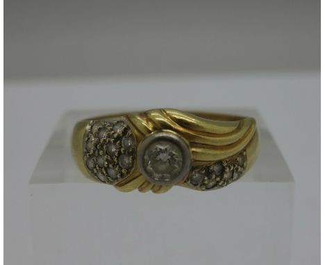 An 18ct gold and diamond ring, weight 5.9g, size W