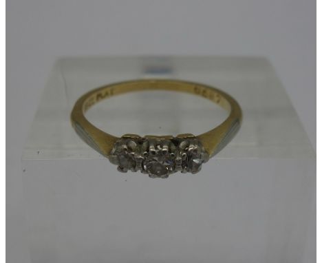 An 18ct gold, three stone diamond ring, weight 2.1g, size M