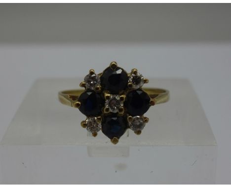 A yellow metal, diamond and sapphire cluster ring, weight 2.5g, size M