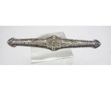 An 18ct white gold, enamel and diamond brooch, weight 5.1g