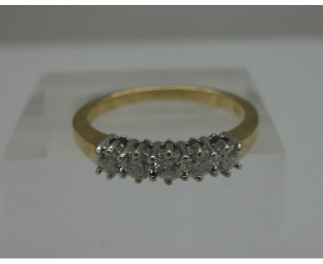 An 18ct gold and five stone diamond ring, 0.5ct diamond weight, stamped 0.50, size P, weight 3.8g