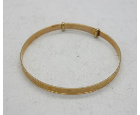 A small 9ct gold bangle, weight 1.4g