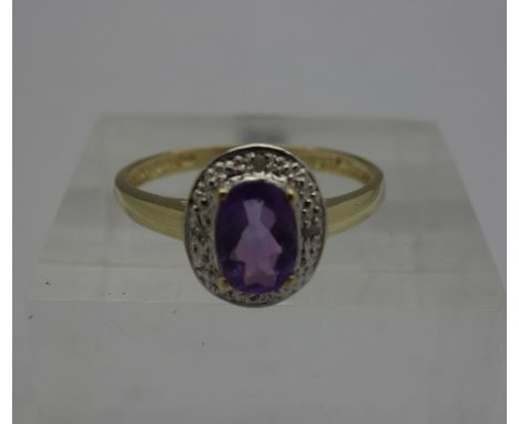 A 9ct gold, amethyst and diamond ring, weight 1.4g, size O