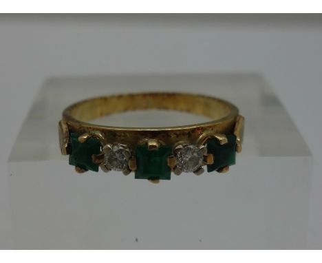 An 18ct gold, diamond and emerald five stone ring, weight 2.9g, size M