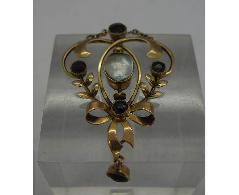 A 9ct gold, garnet and blister pearl pendant