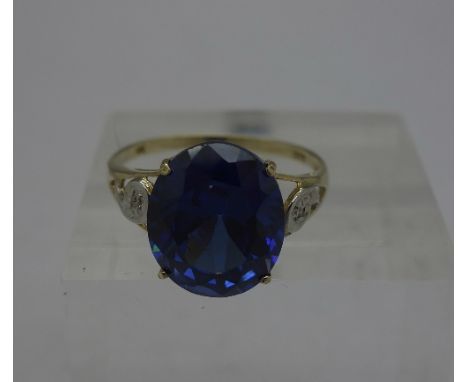 A 9ct gold, blue stone and diamond ring, weight 2.8g, size O