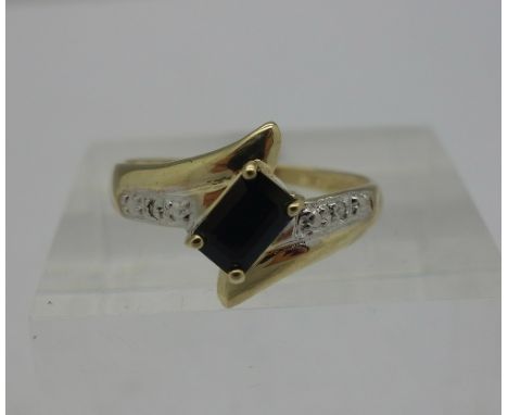 A 9ct gold, diamond and blue stone ring, weight 0.9g, size O