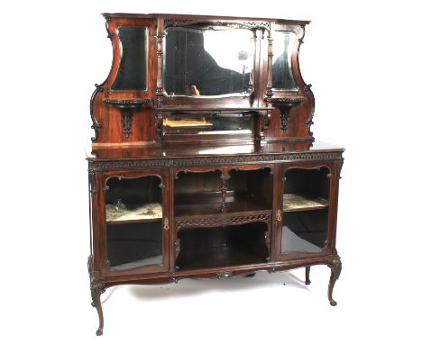 A Late Victorian mahogany mirror back chiffonier. The upper section with four mirrors and two decorative candle shelves and t