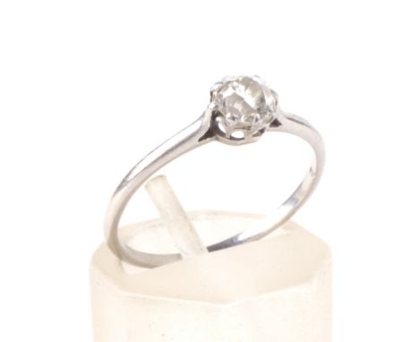 An early 20th century platinum and diamond solitaire ring. The slightly off-round old-cut stone approx 0.42cts, claw set on a