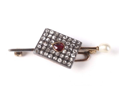 A late Victorian/Edwardian gold, ruby, untested-pearl and diamond brooch. In the form of a central off-set rectangular panel 