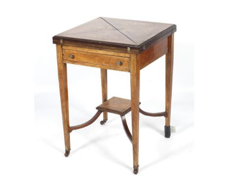 A 19th century rosewood and marquetry envelope games table. The envelope top inlaid with foliage, revealing four wells centre