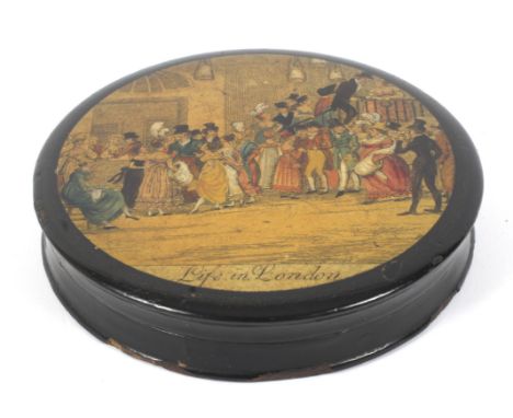 A 19th century lacquered papier mache circular snuff box. Printed with a crowded scene titled Life In London. 9cm diam. 