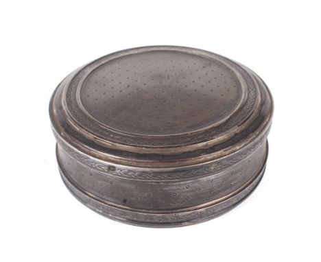 A French silver gilt circular lidded pot. The lid decorated with engine turned decoration with a border depicting a garland o