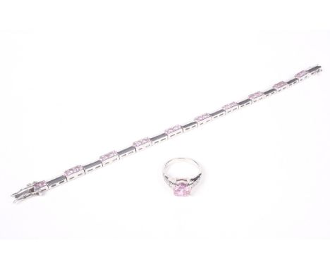 A pink and near-colourless cubic zirconia dress ring and a bracelet. The dress ring centred with an 8mm round pink cubic zirc